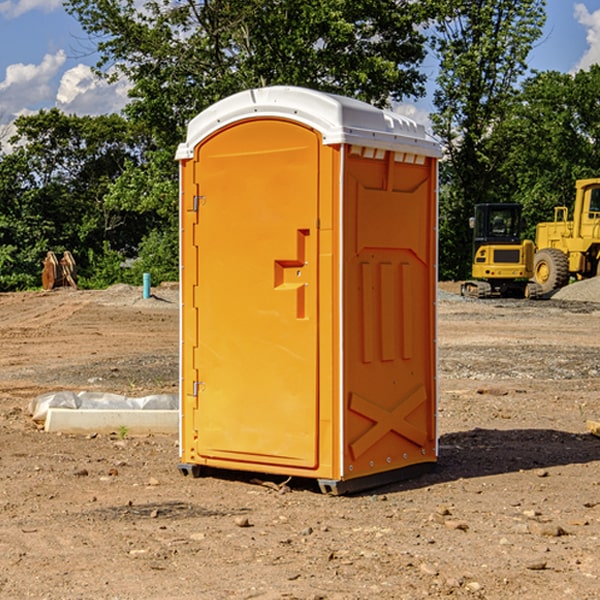 how often are the portable restrooms cleaned and serviced during a rental period in Champion